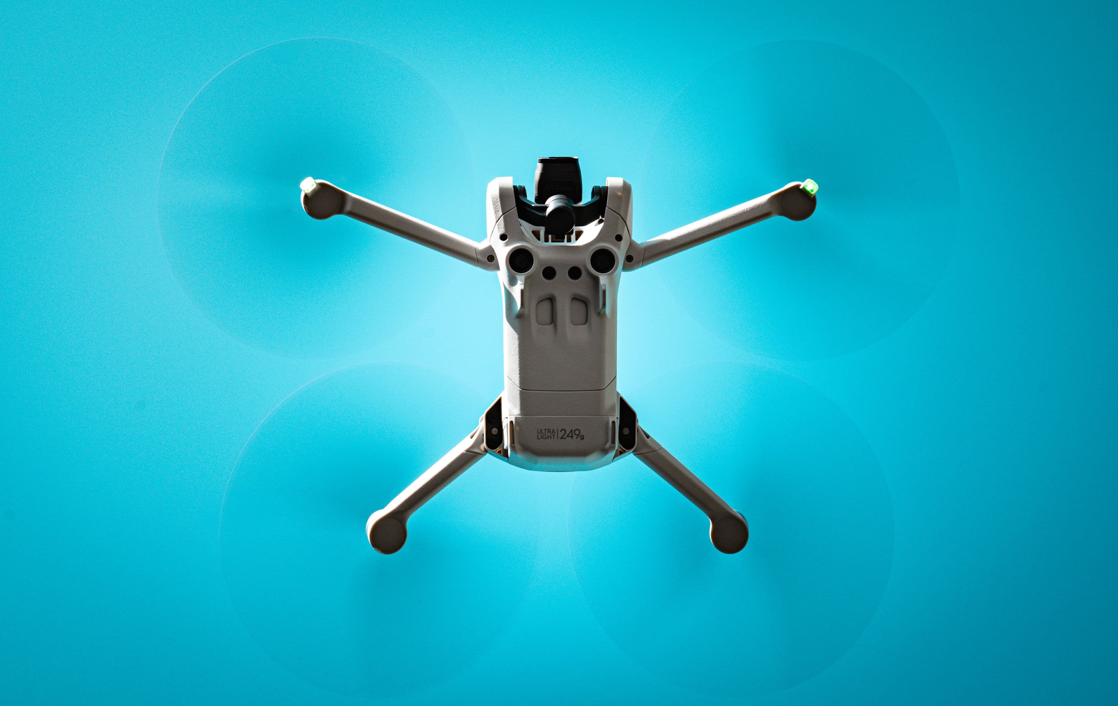 Commercial drone in flight under a clear blue sky